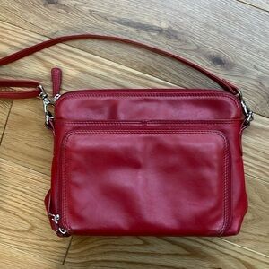 ili RFID protected red leather purse with numerous pockets and adjustable strap